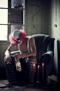 clown with drink and smoke
